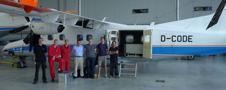 APEX team in front of aircraft