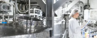 Working with industry machinery at a dairy factory stock photo